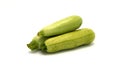 Three zucchini on a light background.