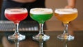 Threecolored cocktails lined up together Royalty Free Stock Photo