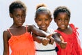 Threesome african girls doing thumbs up together. Royalty Free Stock Photo