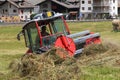 Threshing tractor in action in Cogne on the Sant\'Orso meadow..July 29,2023.