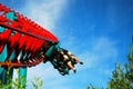 Thrill riders zoom along on a suspended roller coaster Royalty Free Stock Photo