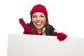 Thrilled Girl Wearing Winter Hat and Gloves Holds Blank Sign Royalty Free Stock Photo