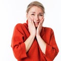 Thrilled woman touching her face for wellbeing and pleasure