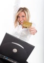 Thrilled young woman with credit card and laptop Royalty Free Stock Photo