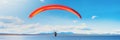 Thrilling alpine paragliding banner on a sunny summer day, showcasing lakes and plains