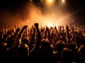 thrilling concert scene with pyrotechnics lighting up the stage as an ecstatic audience raises their hands in unison Royalty Free Stock Photo