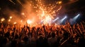 thrilling concert scene with pyrotechnics lighting up the stage as an ecstatic audience raises their hands in unison Royalty Free Stock Photo