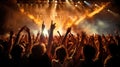 thrilling concert scene with pyrotechnics lighting up the stage as an ecstatic audience raises their hands in unison Royalty Free Stock Photo