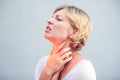 Throat Pain. Closeup Of Sick Woman With Sore Throat Feeling Bad, Suffering From Painful Swallowing. Beautiful Girl Touching Neck Royalty Free Stock Photo