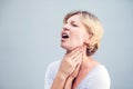 Throat Pain. Closeup Of Sick Woman With Sore Throat Feeling Bad, Suffering From Painful Swallowing. Beautiful Girl Touching Neck Royalty Free Stock Photo