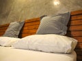 Throw Pillows and pillow on White bed