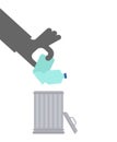 Throw plastic bottle in trash. Hand throws Plastic into trash can