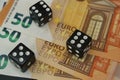 Throwable dice on 50 euro banknotes. Gambling.