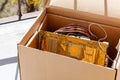 Throwing away electronic waste, obsolete pc components in a carton box, electro trash recycling, old computer parts trashing, eco Royalty Free Stock Photo