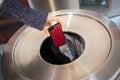 Throwing away mobile phone into rubbish bin. Royalty Free Stock Photo