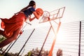 Resolute strong girl with tied hair spending sunny evening on a playground