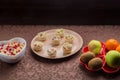 Throwing forks on the table set with salad in tartlets, fruit snacks. Royalty Free Stock Photo