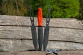 Throwing knife and Shuriken throwing star, on wooden backgroun