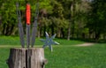 Throwing knife and Shuriken throwing star, on wooden backgroun