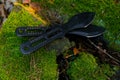 throwing knives on a mossy stump .Sport and hobby