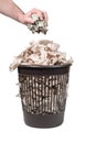 Throwing money in the trash can Royalty Free Stock Photo