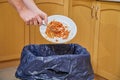 Throwing out wasteful excess food Royalty Free Stock Photo