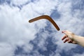 Throwing plain boomerang, midair Royalty Free Stock Photo