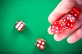 Throwing red poker dices on casino green table Royalty Free Stock Photo