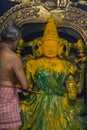 Throwing turmeric over Devi Ranganayaki during Abisheka ceremony at Chennakeshava Temple in Belur, India