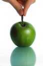 The thrown green tasty-looking apple Royalty Free Stock Photo