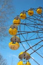 The thrown wheel a review against the blue sky in amusement park in Pripyat after the Chernobyl accent in Royalty Free Stock Photo