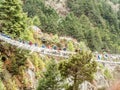 Thukla, Nepal 04/13/2018 : Trekkers crossing the bridge on route to Everest Base Camp