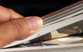 A thumb flipping pages of a comic book Royalty Free Stock Photo