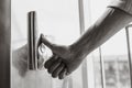 The thumb presses the Elevator button, a hand reaching for the button, the girl waiting for Elevator, push button start Royalty Free Stock Photo