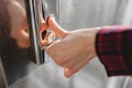 The thumb presses the Elevator button, a hand reaching for the button, the girl waiting for Elevator, push button start Royalty Free Stock Photo