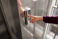 The thumb presses the Elevator button, a hand reaching for the button, the girl waiting for Elevator, push button start Royalty Free Stock Photo