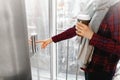 The thumb presses the Elevator button, a hand reaching for the button, the girl waiting for Elevator, push button start, the girl Royalty Free Stock Photo