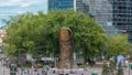 Thumb sculpture by Cesar Baldaccini timelapse and tower block in business district Defense