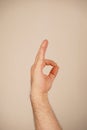 The thumb sign is easily recognized around the world. The thumb and index finger form a loop, with the other fingers Royalty Free Stock Photo