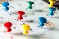 Thumb tack pins on calendar as reminder Royalty Free Stock Photo