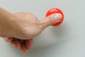 Thumb touch on red emergency stop switch Royalty Free Stock Photo