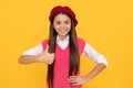 thumb up. back to school. cheerful kid in beret. smiling child has perfect style. teenage beauty
