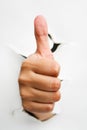 Thumb up from crack wall Royalty Free Stock Photo