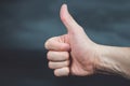 Thumb up on dark background Royalty Free Stock Photo