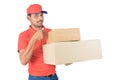 Thumb up delivery man holding carton box in uniform Royalty Free Stock Photo