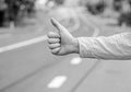 Thumb up gesture try stop car road background. Hand gesture hitchhiking. Make sure you know right gestures to stop car Royalty Free Stock Photo