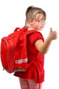 Thumb up girl with red schoolbag isolated on white Royalty Free Stock Photo