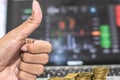 Thumb up hand and coin with monitor shows trading traffic, Bitcoin minning