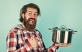 Thumb up. professional cook. bearded man hold kitchen pan. brutal hipster cooking with saucepan. housekeep husband cook Royalty Free Stock Photo