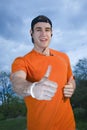 Thumb up and smiling runner Royalty Free Stock Photo